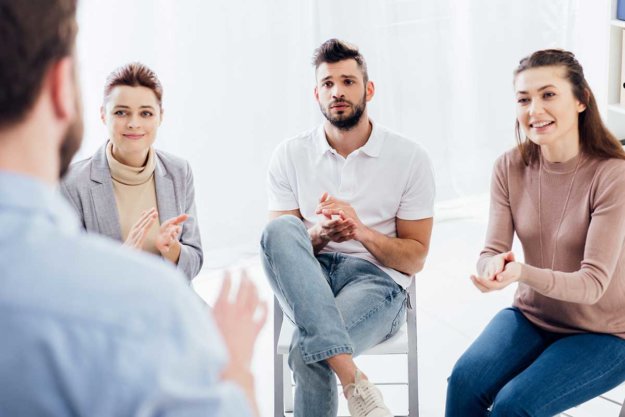therapy group meets at opioid addiction treatment center
