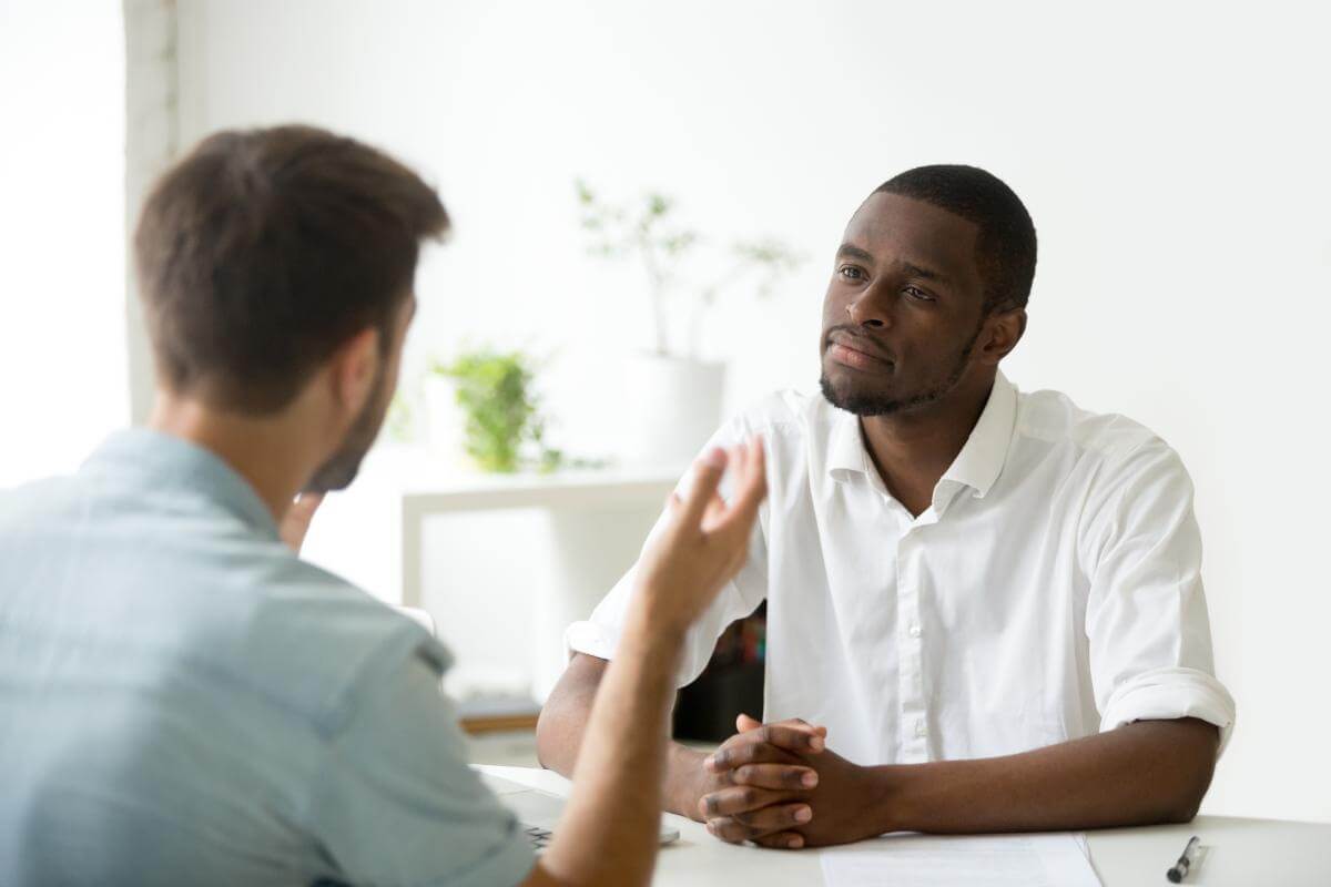 two men talking about opioid rehab center